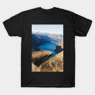 Man sitting on Trolltunga rock meditating T-Shirt